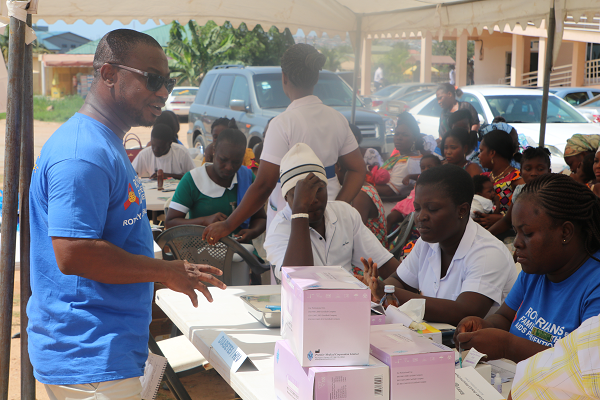 the President-elect of Rotary Club of Accra-Labone, Mr P.E. Yaw Abrokwa speaking with some of the health staff during the exercise