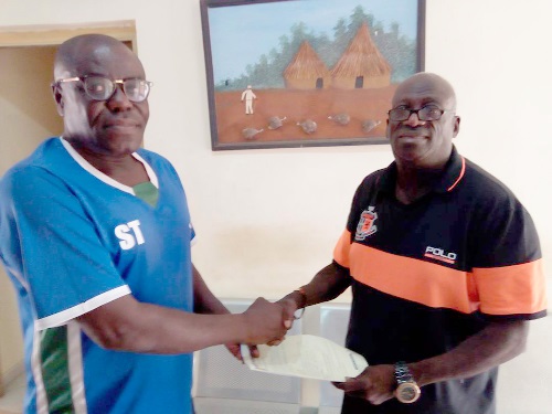 • Coach Sellas Tetteh in a handshake with Tamale City (CEO), Jones Alhassan-Abu (right)