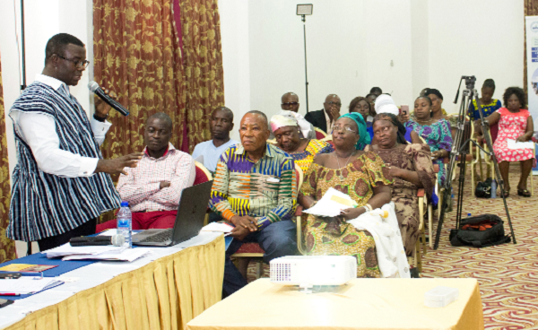 Mr Samuel A. Afram (left) briefing participants on the proposed interventions 
