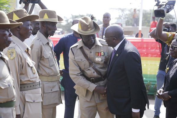 Dr Mahamudu Bawumia (left), interacting with some war veterans at the ceremony 