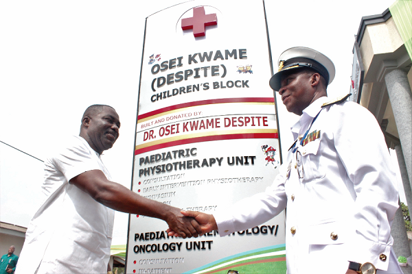 Mr Osei Kwame Despite (left), the Group CEO of Despite Group, exchanging pleasantries with Rear Admiral Peter Kofi Faidoo, the Chief of Naval Staff, as he hands over the facility to the Ghana Armed Forces. 
