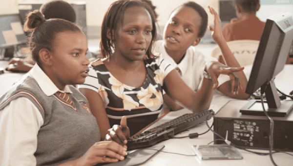  African girls learning how to use the computer
