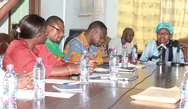 Madam Victoria Adongo (far end of the table) in a meeting with some stakeholders.