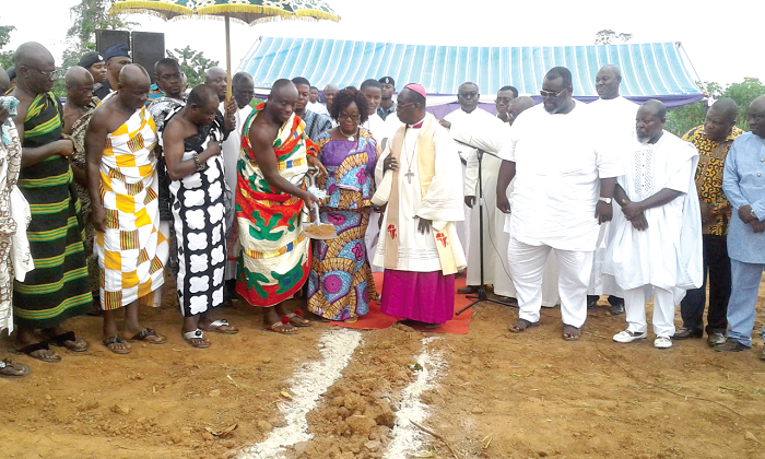A representative of the Asantehene, Amakomhene (with the spade) performing a cermony for the commencment of the project at Sokwai-Mfensi