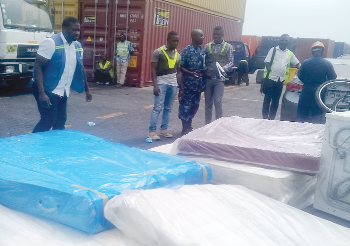 Shipping agents captured negotiating a deal with a customs official.