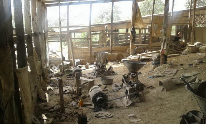 A stone grinding machine shop used by the illegal miners