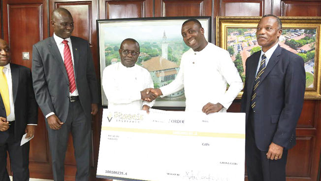Mr Adu Sarkodie (2nd right) making the donation to Prof Ebenezer Oduro Owusu