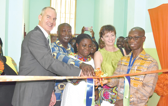Mr Andrew Barnes (left), the Australian High Commissioner in Accra, Mrs Elizabeth Bruce (3rd left), the Director of Pharmacy, Korle Bu and Mr Kenneth Baidoo, Head of the Ear, Nose and Throat (ENT) Department at the Korle Bu Teaching Hospital, cutting the tape for the opening of the refurbished Speech and Language Therapy Centre