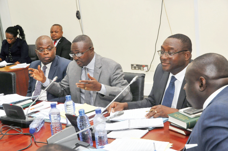 The Chairman of the committee, Mr Kwasi Ameyaw-Cheremeh (2nd left), and other members during the sitting