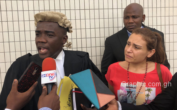 Haddah’s lawyer, Mr Ralph Poku-Adusei talking to the media after his client was granted bail. With him is the wife of the accused