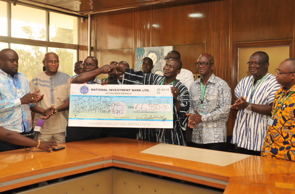 Mr Osei Assibey Antwi (3rd left), presenting a dummy cheque to Prof. Obiri-Danso