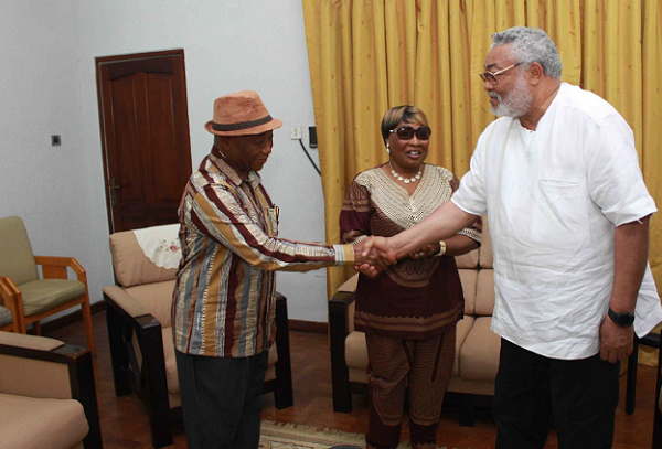 Mr Rawlings (right) commending Mr Boakai(right) while his wife Katumu Yatta looks on  