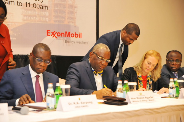 Mr Boakye Agyarko (2nd left) signing the agreement with Ms Pamela Darwin in Accra yesterday. Others appending their signatures to the document are Dr K.K. Sarpong (left), the CEO of the GNPC, and Mr Freddie Blay, the Chairman of the GNPC Board