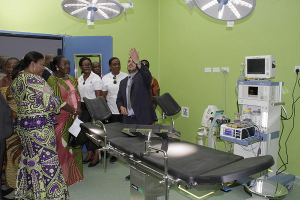 Mr Eric Gene (hand raised), Partner, Africa Building Partners, the contractors for the project, explaining a point to the First Lady, Mrs Akufo-Addo (left), during a tour of one of the theatres at the unit. With them is Lady Julia Osei (2nd left), the wife of the Asantehene. 
