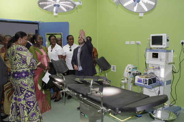 Mr Eric Gene (hand raised), Partner, Africa Building Partners, the contractors for the project, explaining a point to the First Lady, Mrs Akufo-Addo (left), during a tour of one of the theatres at the unit. With them is Lady Julia Osei (2nd left), the wife of the Asantehene. 