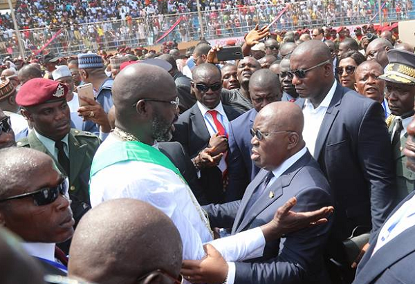 President Akufo-Addo in an embrace with President George Weah