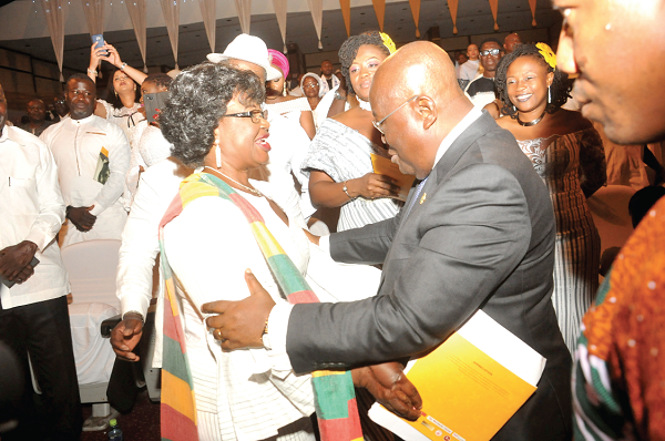 President Akufo-Addo embraces Mrs Fulera Limann at the ceremony