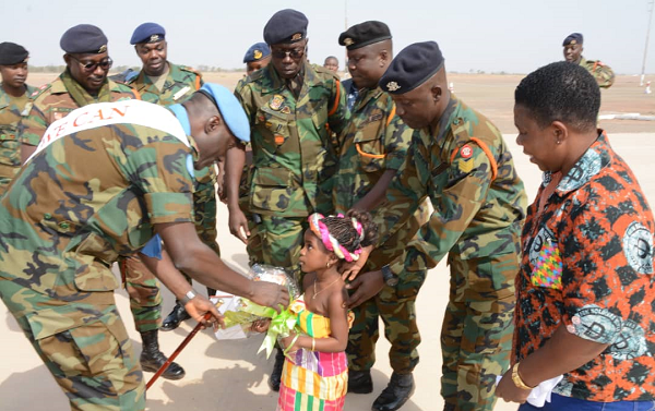 LT. Col. Kwabiah being welcome by a little girl at the Air Force Base in Tamale