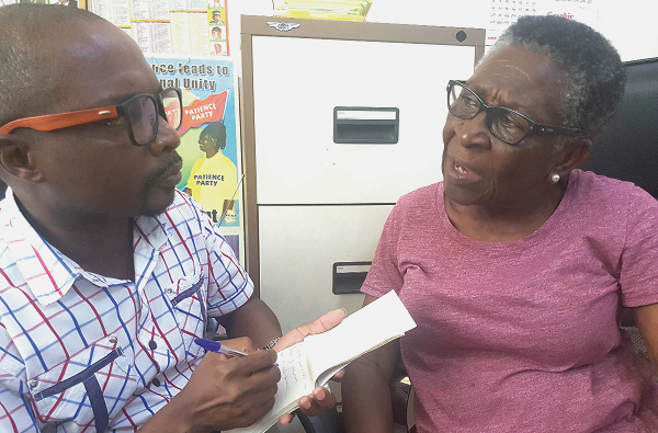 Madam Lucy Anin sharing a point with Daily Graphic’s Staff Writer, Victor Kwawukume