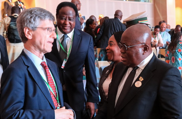 President Akufo-Addo at the 31st AU Summit, exchanging pleasantries with an official of the EU