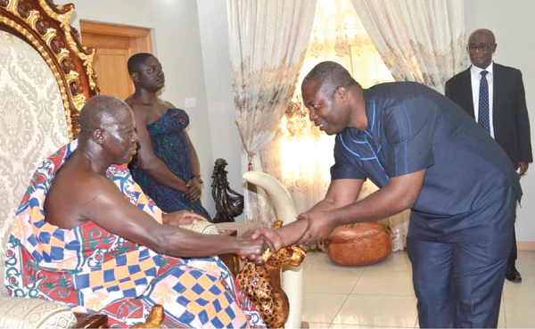 The new Managing Director of BOST exchanging pleasantries with the Asantehene, Otumfuo Osei Tutu II
