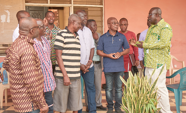 Dr Aubynn (right) interacting with Mr Kojo Mattah and members of the delegation at the palace