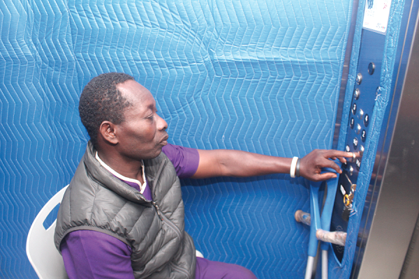 On a daily basis, Mr Akoto and his colleagues help patients to access the various floors at the hospital.