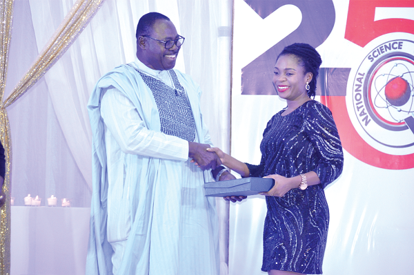 Mr Kweku Mensah Bonsu (Left), Chairman of Primetime, presenting the award to Miss Sena Adjasi