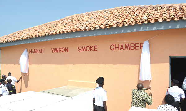 Mr Ambrose Dery (arrowed), the Minister for the Interior, unveiling the new smoke chamber. To his left is the Acting Chief Fire Officer of the GNFS, Mr Edwin Ekow Blankson