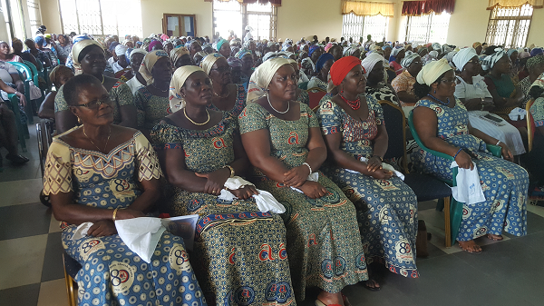 Members of the congregation listening to an address