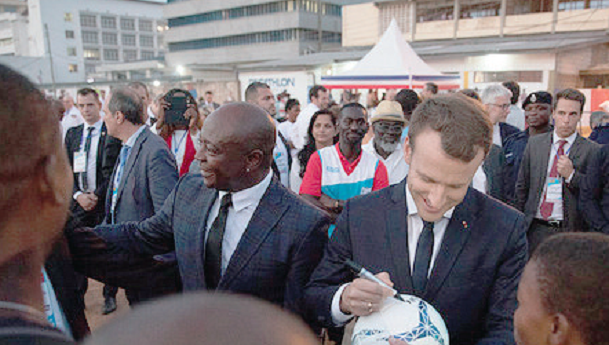 President Macron and Abedi Pele,́ former Olympic Marseille player and ex-captain of the Black Stars