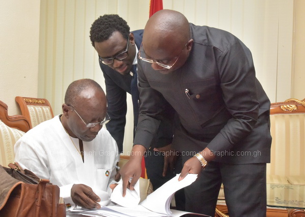 Vice-President Bawumia and Mr Ken Ofori-Atta going through some documents