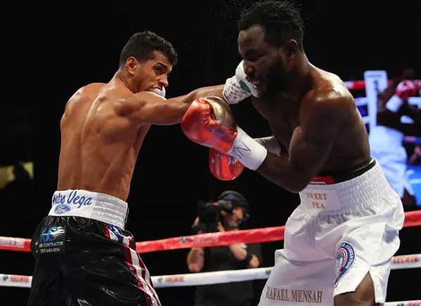 Machado dominates Mensah to retain WBA title