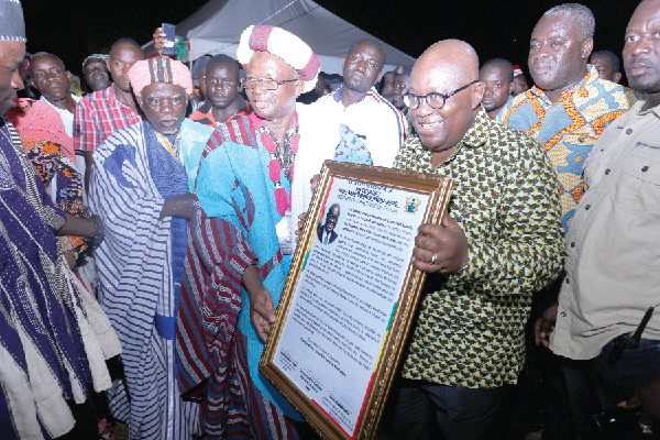 President Akufo-Addo displaying a citation presented to him by Naa Yakubu Abdulai, Sagnari Naa. Picture: SAMUEL TEI ADANO