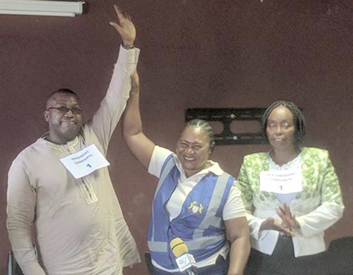An official of the Electoral Commission declares Dr Asante winner of the election. On the right is Ms Elizaeth King, the new vice president of the GHA