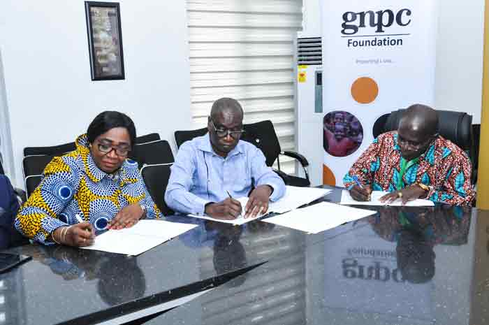 Professor Kwasi Obiri-Danso (right), the Vice Chancellor signed on behalf of KNUST whiles Dr. Kofi Koduah Sarpong (middle), Chief Executive Officer and Ms. Matilda Ohene, Secretary to the Board signed for GNPC.