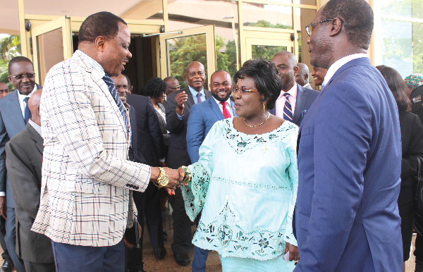  Mrs Cecilia Dapaah (2nd right) in a handshake with Colonel Lata Gnama, the Director General of the Togo Civil Aviation Authority, during on interaction with dignitaries at the end of the opening ceremony for the two-day workshop