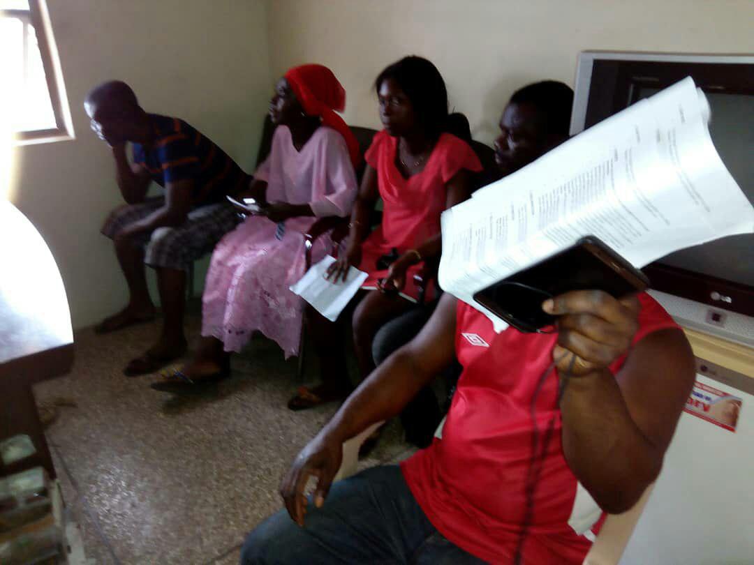Some of the suspects in the process of paying up their bills at the ECG  office after their arrest.