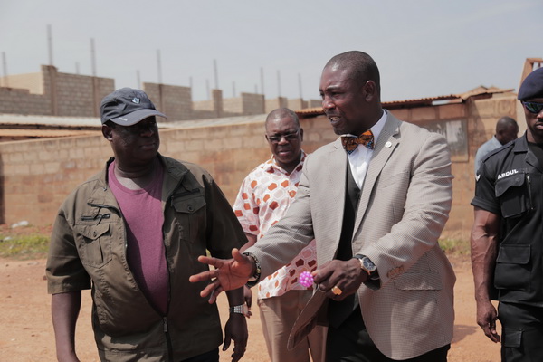 Dr Okoe Boye (right), MP for Ledzokuku, interacting with Mr Kwesi Amoako-Atta, when the minister inspected the Teshie Link road. 