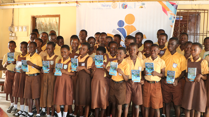 Some of the pupils in a pose with their books