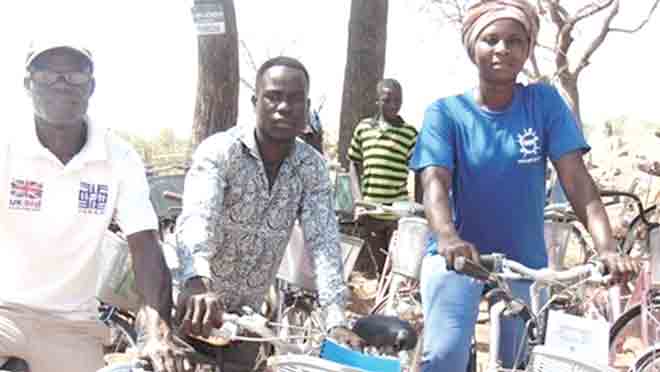 Some of the volunteers trying their bicycles