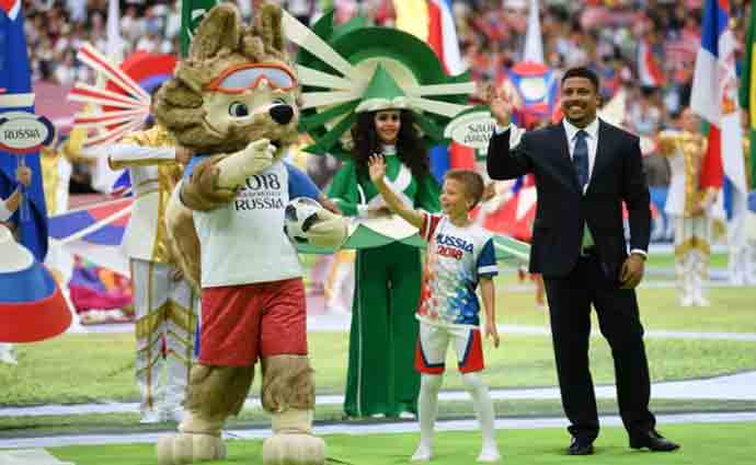 Brazil football legend Ronaldo and World Cup mascot, Zabivaka, arrive for the opening ceremony yesterday