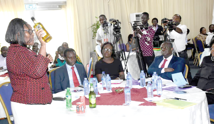  Mrs Isabella Mansa Agra, the Head of Food Division of the Food and Drugs Authority (FDA), showing the judges some of the unsatisfied products confiscated on the market 