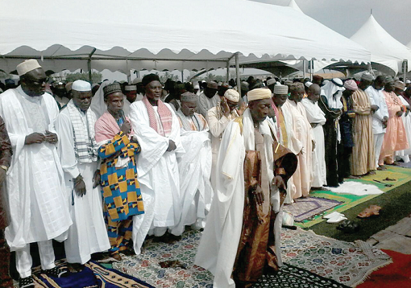 Mr Felix Mensah Anang-La (left), the Tema Metropolitan Chief Executive, joined in the prayers, led by the Metro Chief Imam, Adam Abubakar