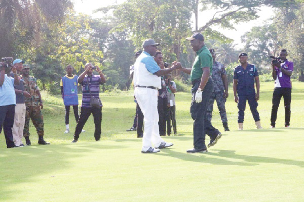Otumfuo Osei Tutu II (right) congratulating Osagyefo Amoatia Ofori Opanin II after they teed-off to open the competition