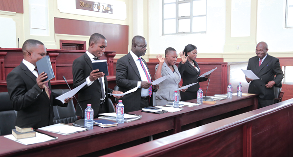 Mr Justice Victor Ofoe (right) administering the Oath of Office to the new JUSAG executive members.  Picture: EMMANUEL ASAMOAH ADDAI  