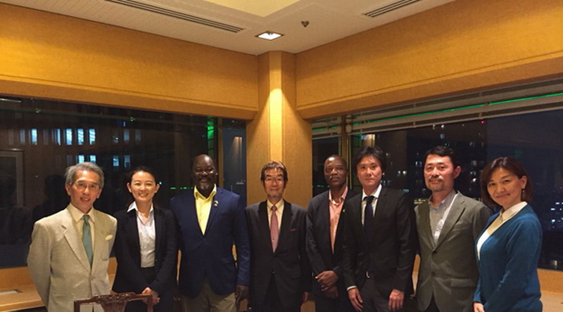 From left to right:  Prof. Shoji Yamaoka, AMED J-Grid Project, (TMDU), Ms. Toshie Kyo (Mitsui &amp; Co., Ltd)., Prof. Abraham Kwabena Anang, (Director, NMIMR, UG), Prof. Tetsuya Taga, (Vice President, TMDU), Prof. Patrick F. Ayeh-Kumi, (Provost, College of Health Sciences, UG), Mr. Yusuke Satake (Modec, Inc.), Prof. Shiroh Iwanaga, (Project Leader, AMED J-Grid Project, TMDU), Prof. Mitsuko OHASHI, (Project Manager, AMED J-Grid Project, TMDU)