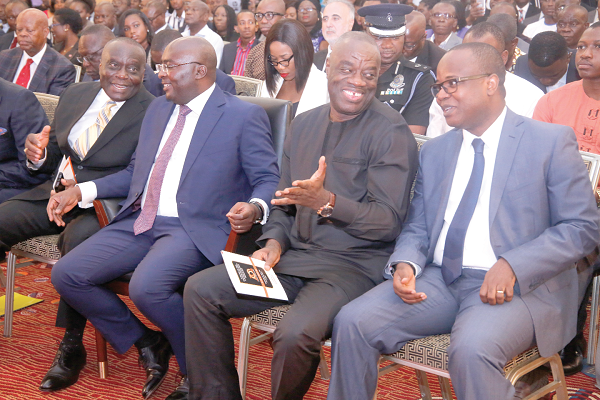 Dr Mohammed Ibrahim Awal (2nd right), the Minister of Business Development, interacting with Mr  Maxwell Opoku Afari (3rd left), First Deputy Governor, BOG, whereas Vice President Mahamudu Bawumia (2nd left) and Mr Peter Osei-Duah (right), the Board Chairman, also interacting at the 10th anniversary celebration of Bond Savings and Loans in Accra. Picture: SAMUEL TEI ADANO