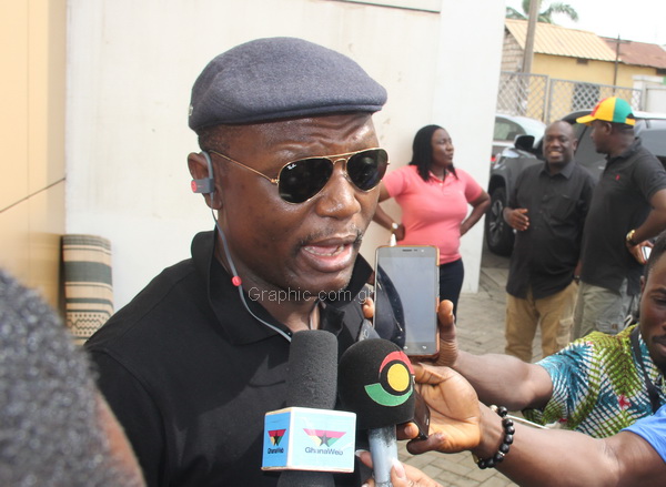  Mr Kofi Adams, NDC National Organiser, explaining a point to journalists at the party headquaters in Accra.