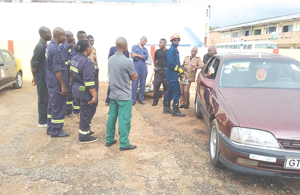 Rescue team from Fire Service undergoing the process of removing victims of road crashes from a  vehicle
